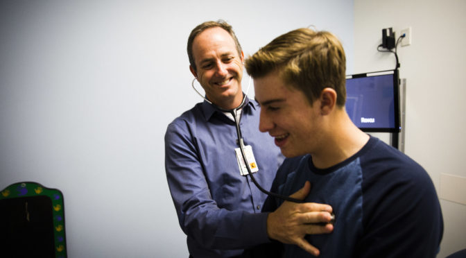 teen boy with pediatrician